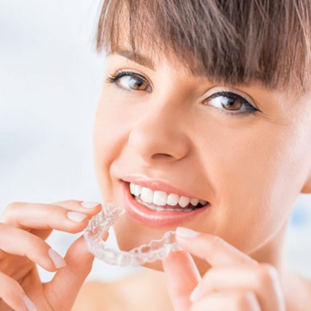 Patient preparing to wear clear aligners